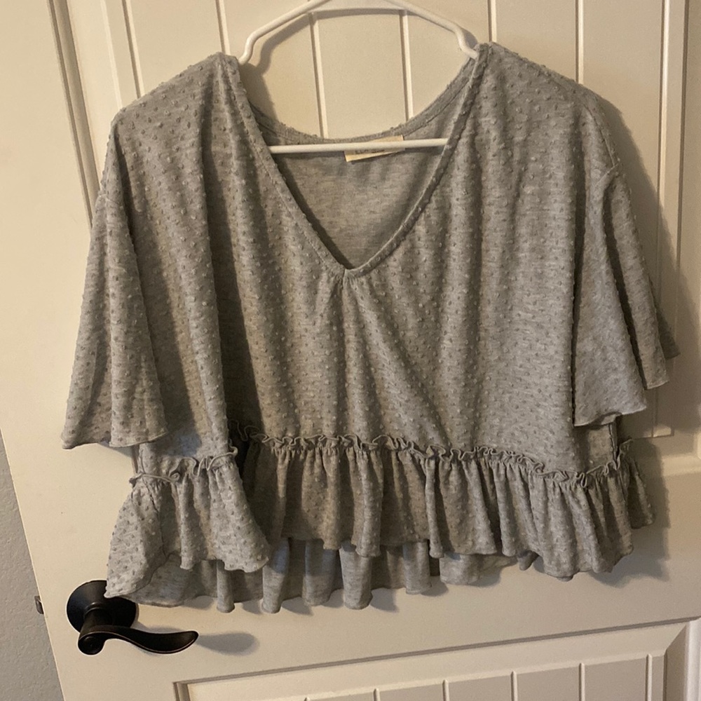 the cutest gray top with little bubbles and ruffles